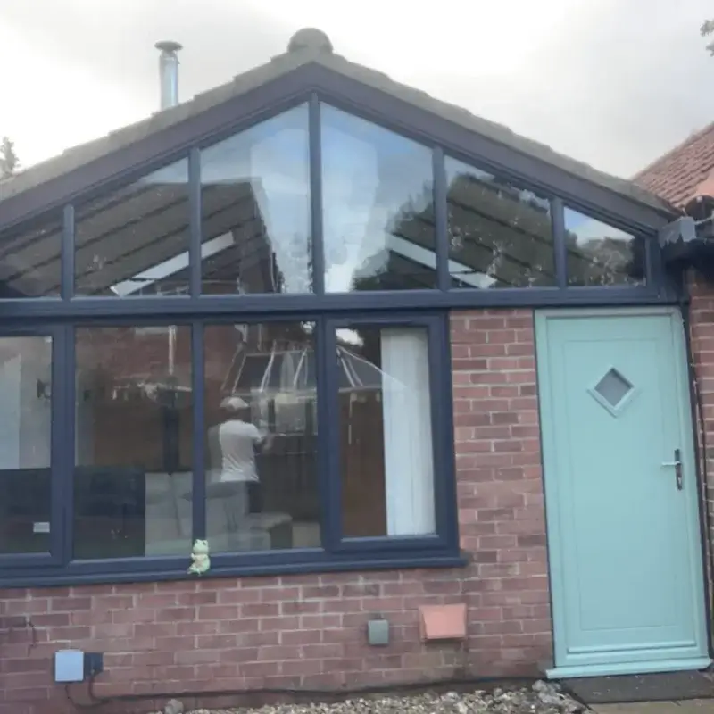 Stylish grey uPVC sliding patio doors maximising natural light and offering smooth operational performance. Fitted by Norfolk Exterior Solutions